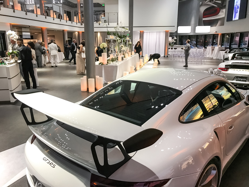 Illustration for article titled This Couple Topped Your Wildest Dreams By Getting Married In A Porsche Showroom